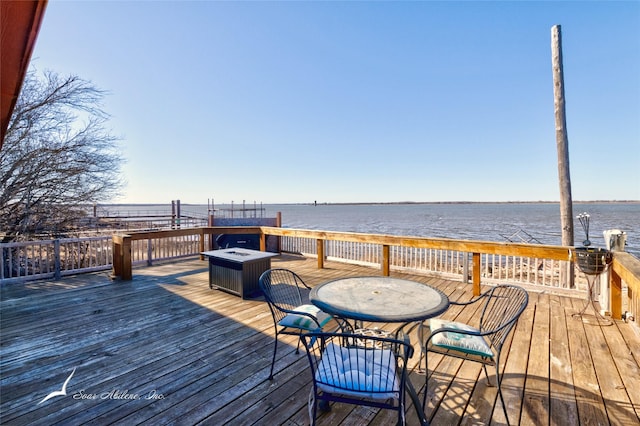 wooden deck featuring a water view