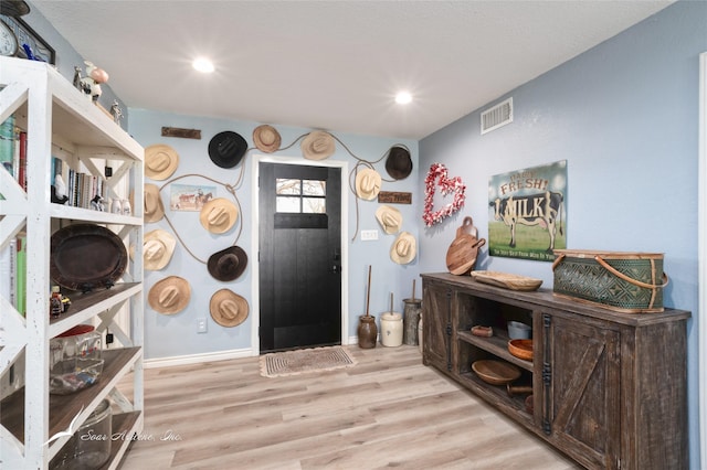 entrance foyer with light hardwood / wood-style flooring