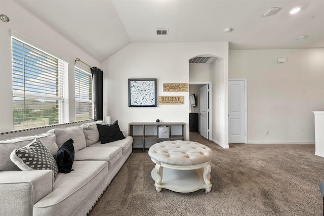 living room featuring lofted ceiling and dark colored carpet