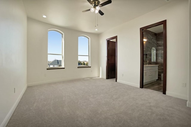 empty room with ceiling fan and carpet