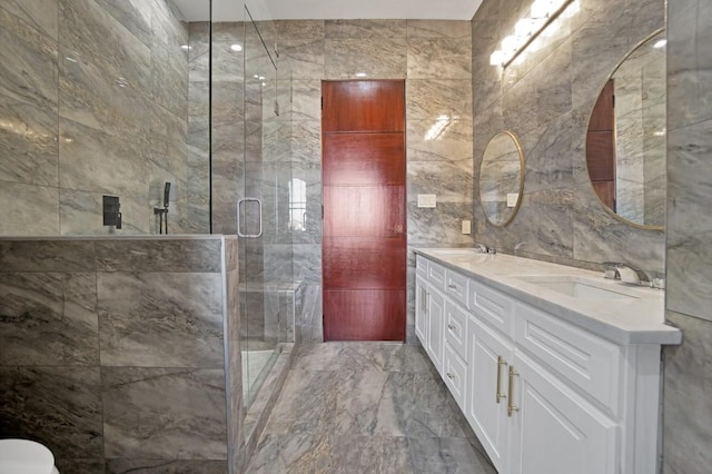 bathroom featuring tile walls, vanity, and a shower with door