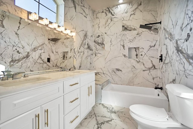 bathroom with vanity, tile walls, and toilet