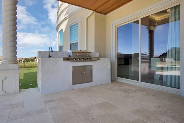 view of patio / terrace with a grill and an outdoor kitchen