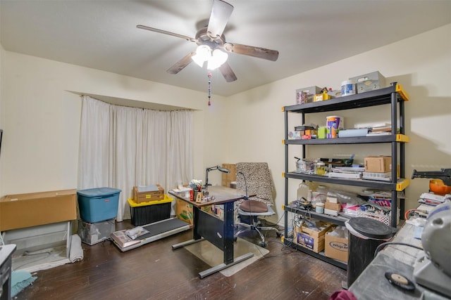 home office with dark hardwood / wood-style flooring and ceiling fan