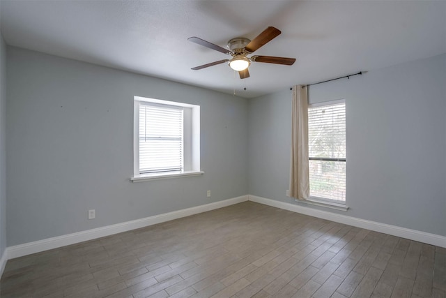 spare room featuring ceiling fan and wood-type flooring