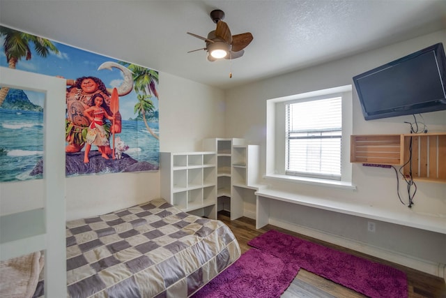 bedroom featuring wood-type flooring and ceiling fan