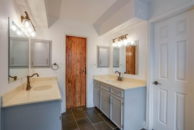 bathroom featuring tile patterned flooring and vanity