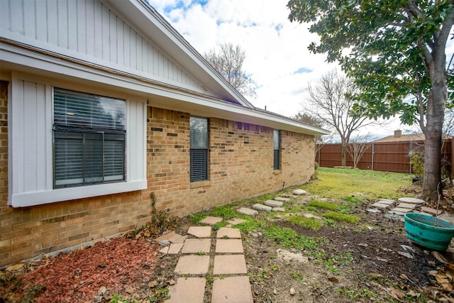 view of property exterior with a lawn