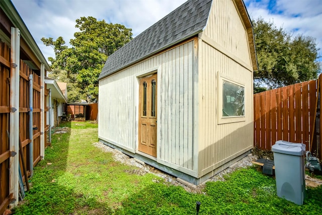 view of outbuilding featuring a yard