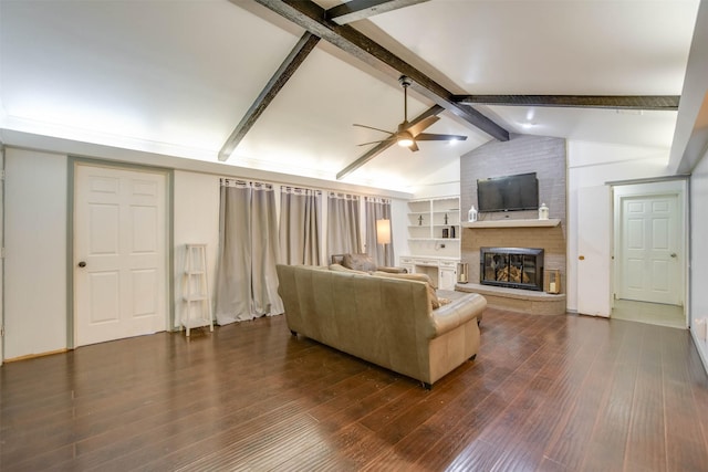 living room featuring vaulted ceiling with beams, a fireplace, dark hardwood / wood-style floors, and ceiling fan