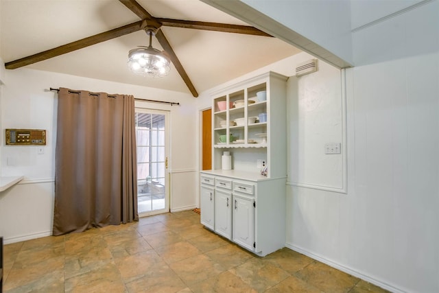 kitchen with lofted ceiling with beams