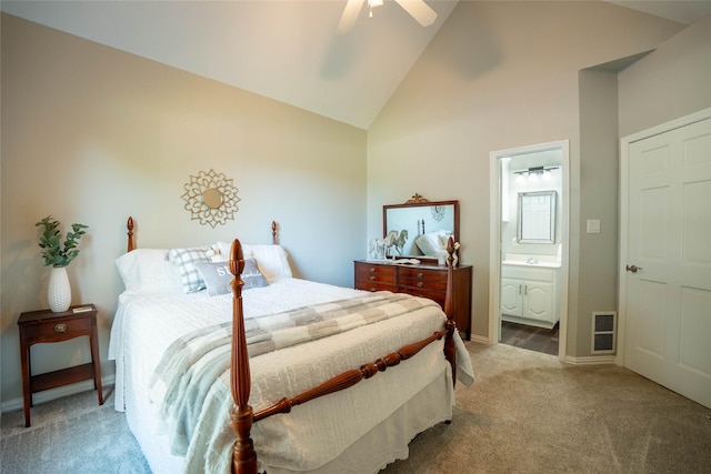 bedroom featuring connected bathroom, high vaulted ceiling, ceiling fan, and carpet