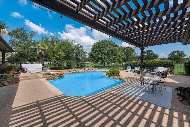 view of swimming pool featuring a pergola and a patio