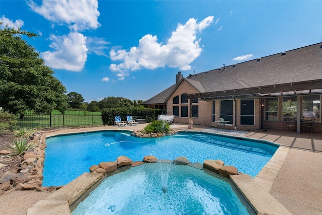 view of pool with an in ground hot tub and a patio