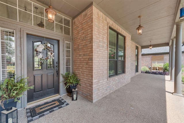 entrance to property featuring a porch