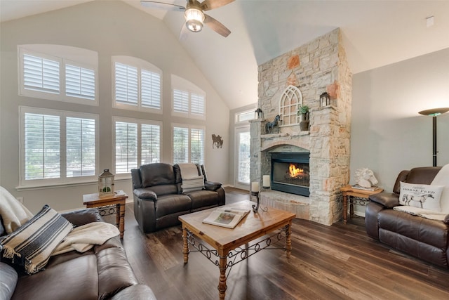 living room featuring a fireplace, high vaulted ceiling, dark hardwood / wood-style floors, and ceiling fan