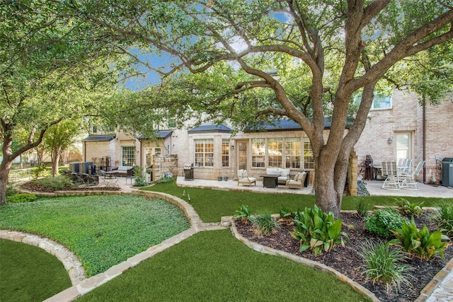 rear view of property featuring an outdoor living space, central AC unit, a patio area, and a lawn