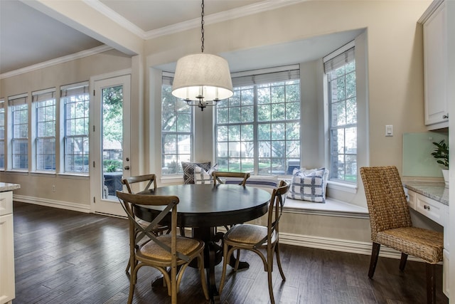 dining area featuring ornamental molding and dark hardwood / wood-style floors