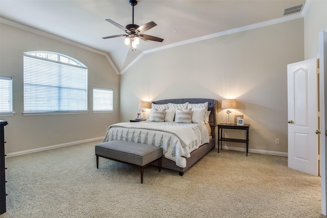 carpeted bedroom featuring crown molding, lofted ceiling, and ceiling fan