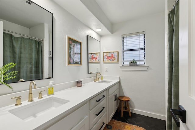 bathroom featuring vanity and tile patterned flooring