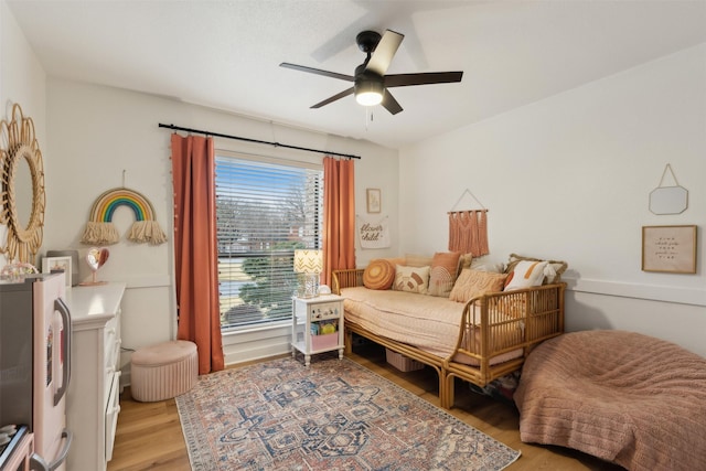 bedroom featuring ceiling fan and light hardwood / wood-style floors