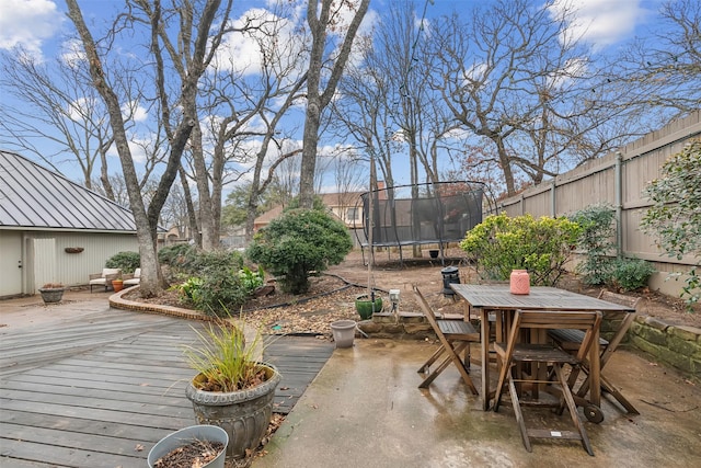 wooden terrace featuring a trampoline