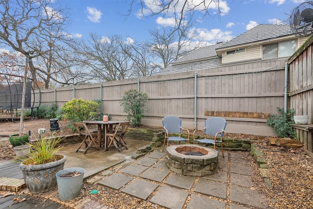 view of patio / terrace with a fire pit