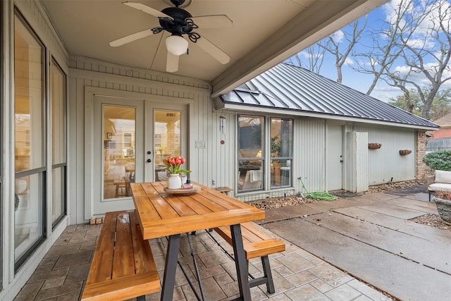 sunroom featuring ceiling fan