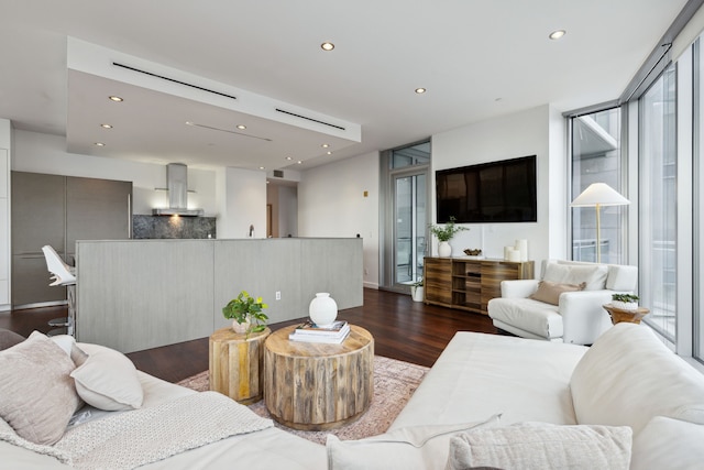 living room with expansive windows and dark hardwood / wood-style flooring