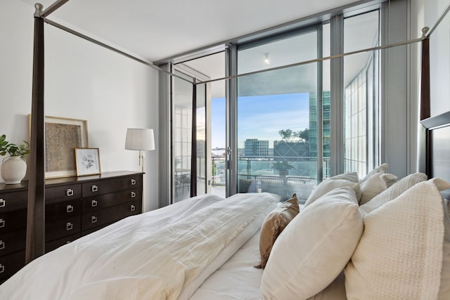 bedroom featuring access to exterior and expansive windows