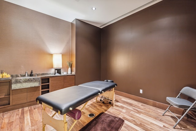 interior space with sink and light hardwood / wood-style flooring