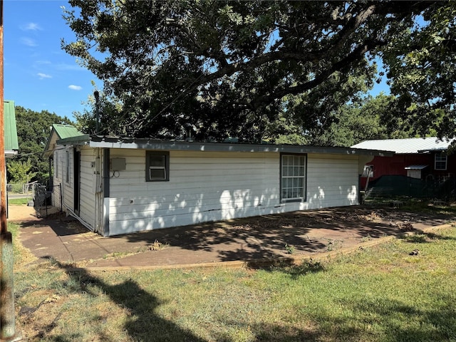 view of outbuilding with a yard