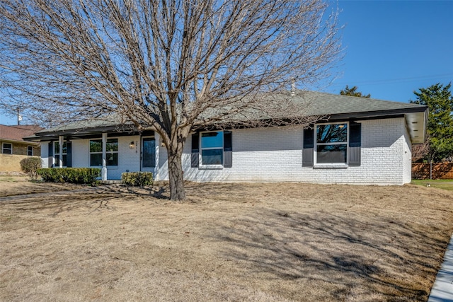 view of front of property featuring brick siding