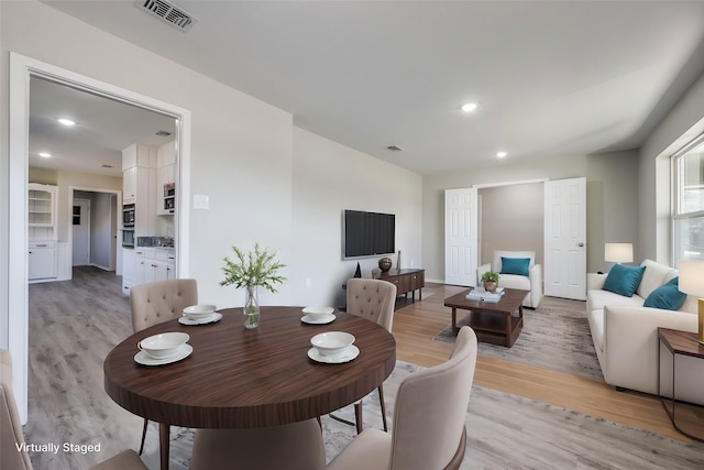 dining space featuring light hardwood / wood-style flooring