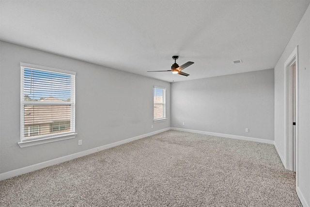 unfurnished room with carpet floors and ceiling fan