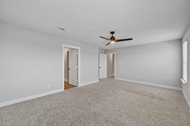 unfurnished bedroom featuring light carpet and ceiling fan