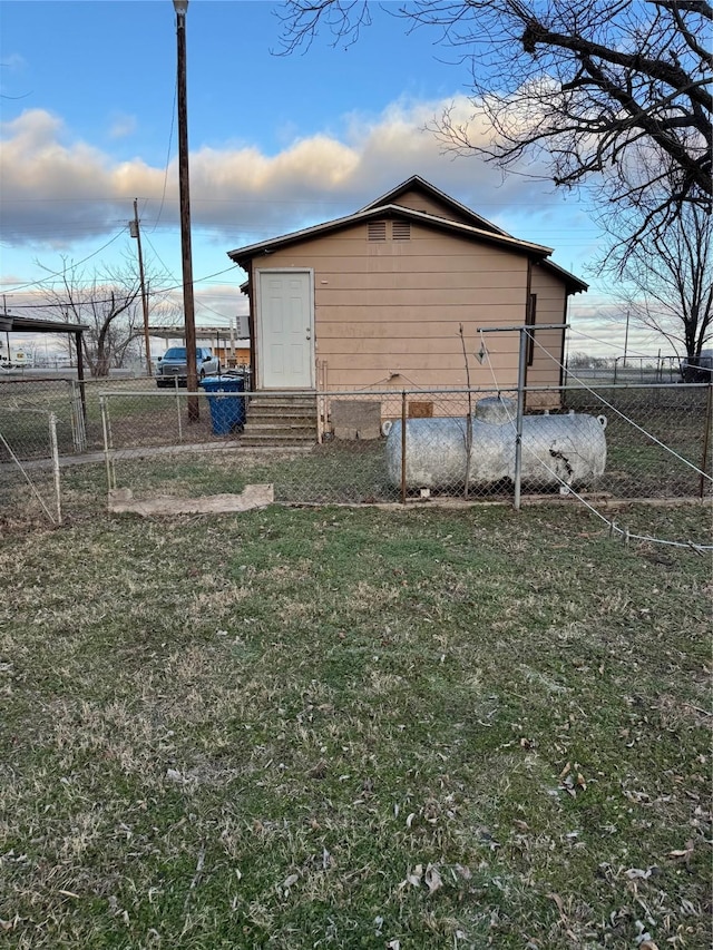 view of outbuilding with fence and entry steps