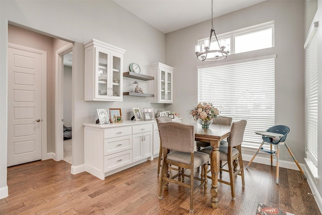 dining room featuring a chandelier and light hardwood / wood-style flooring