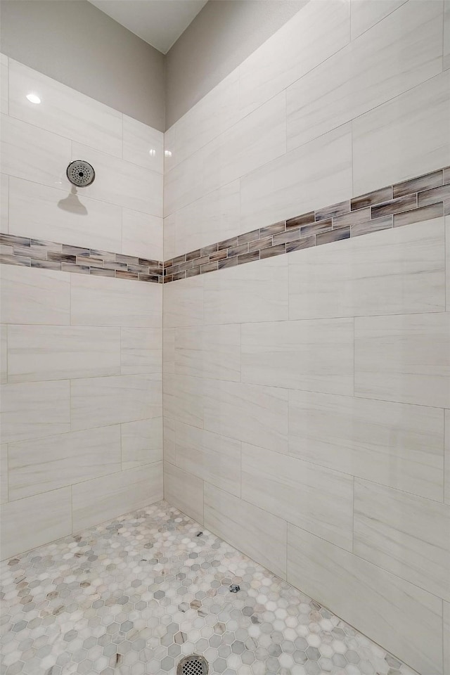 bathroom with a tile shower