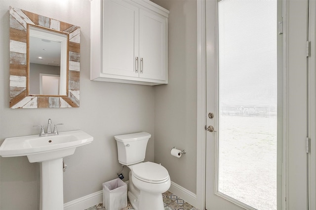 bathroom with sink and toilet