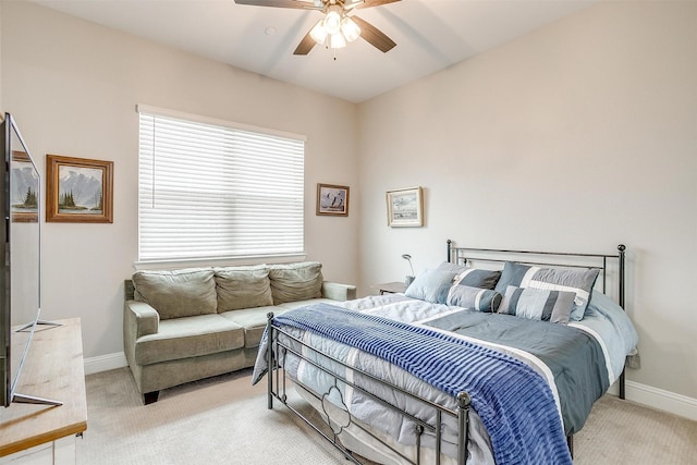 bedroom with light colored carpet and ceiling fan