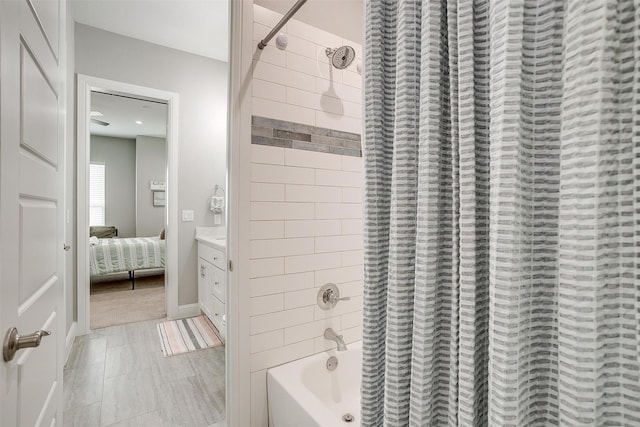 bathroom featuring shower / tub combo with curtain and vanity