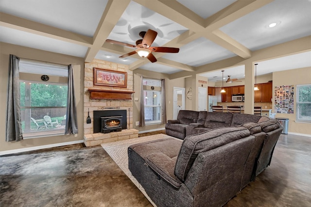 living room featuring ceiling fan, coffered ceiling, and beam ceiling