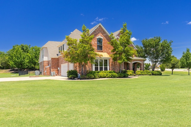 view of front facade featuring a garage and a front lawn