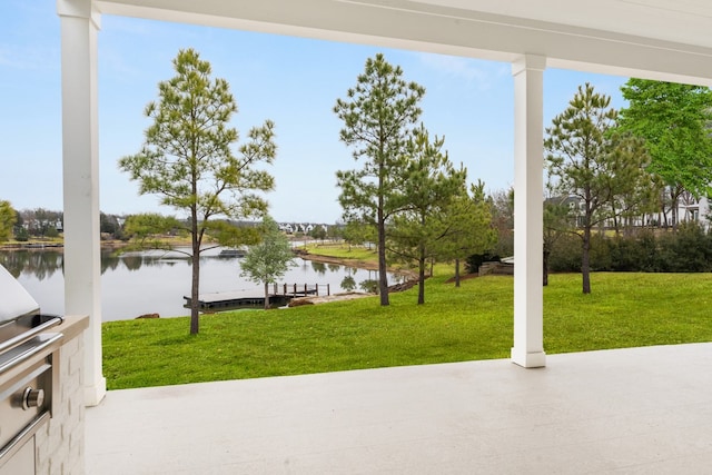 view of patio with a water view