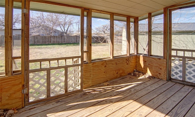 unfurnished sunroom featuring wood ceiling