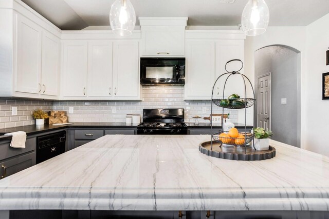 kitchen with sink, gray cabinets, white cabinetry, black appliances, and a kitchen island