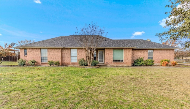 single story home with a front lawn