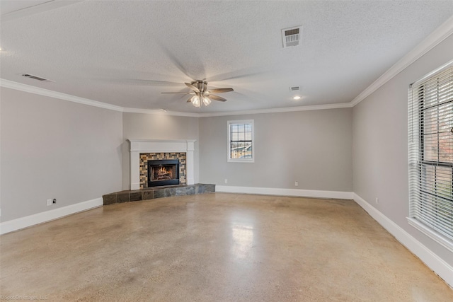 unfurnished living room featuring a textured ceiling, a fireplace, ornamental molding, and ceiling fan