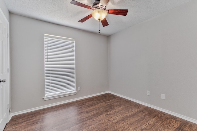 unfurnished room with ceiling fan, a textured ceiling, and dark hardwood / wood-style flooring